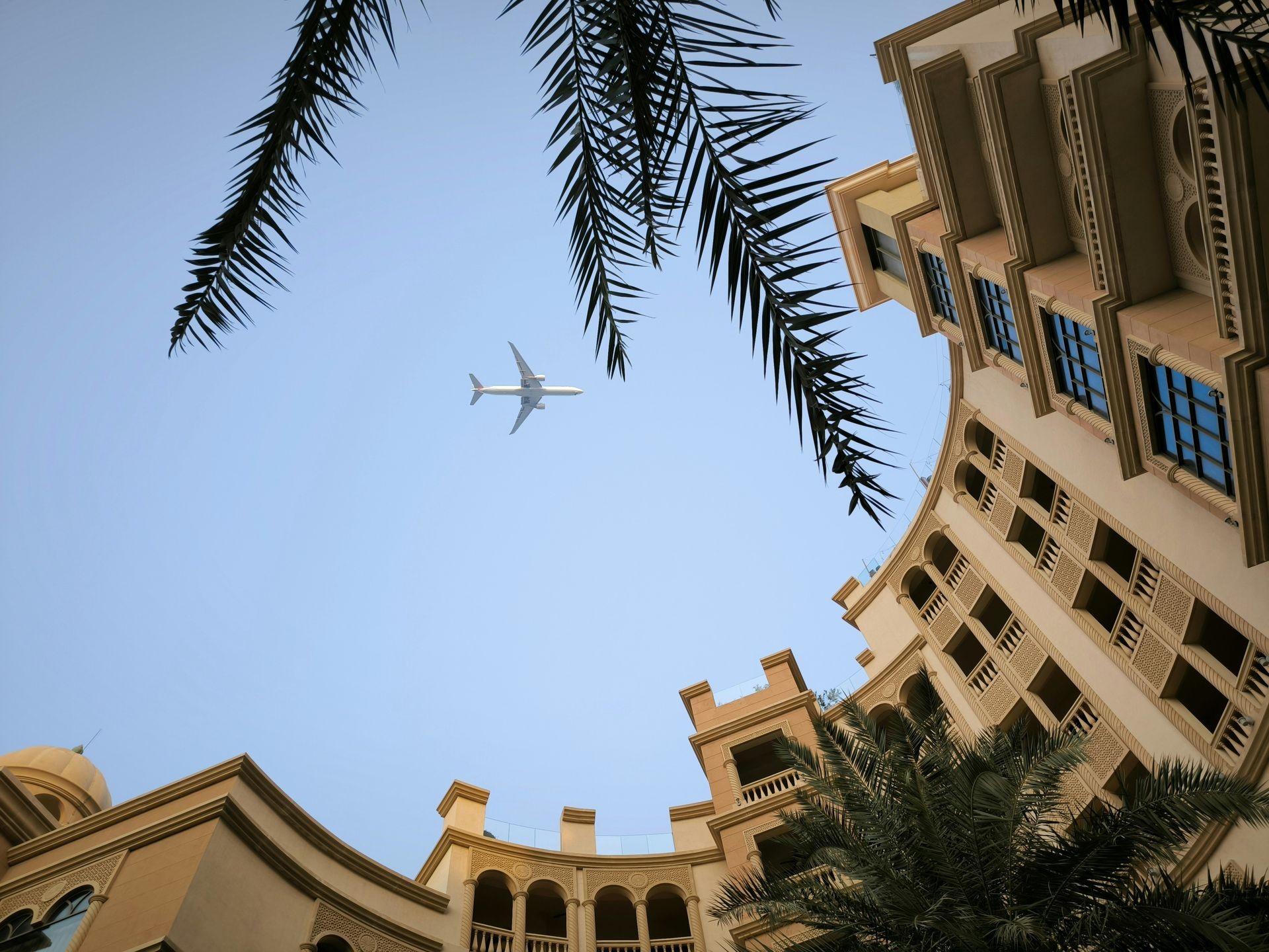 Modern hotel and airplane representing booking accommodation and flights with Trip.com