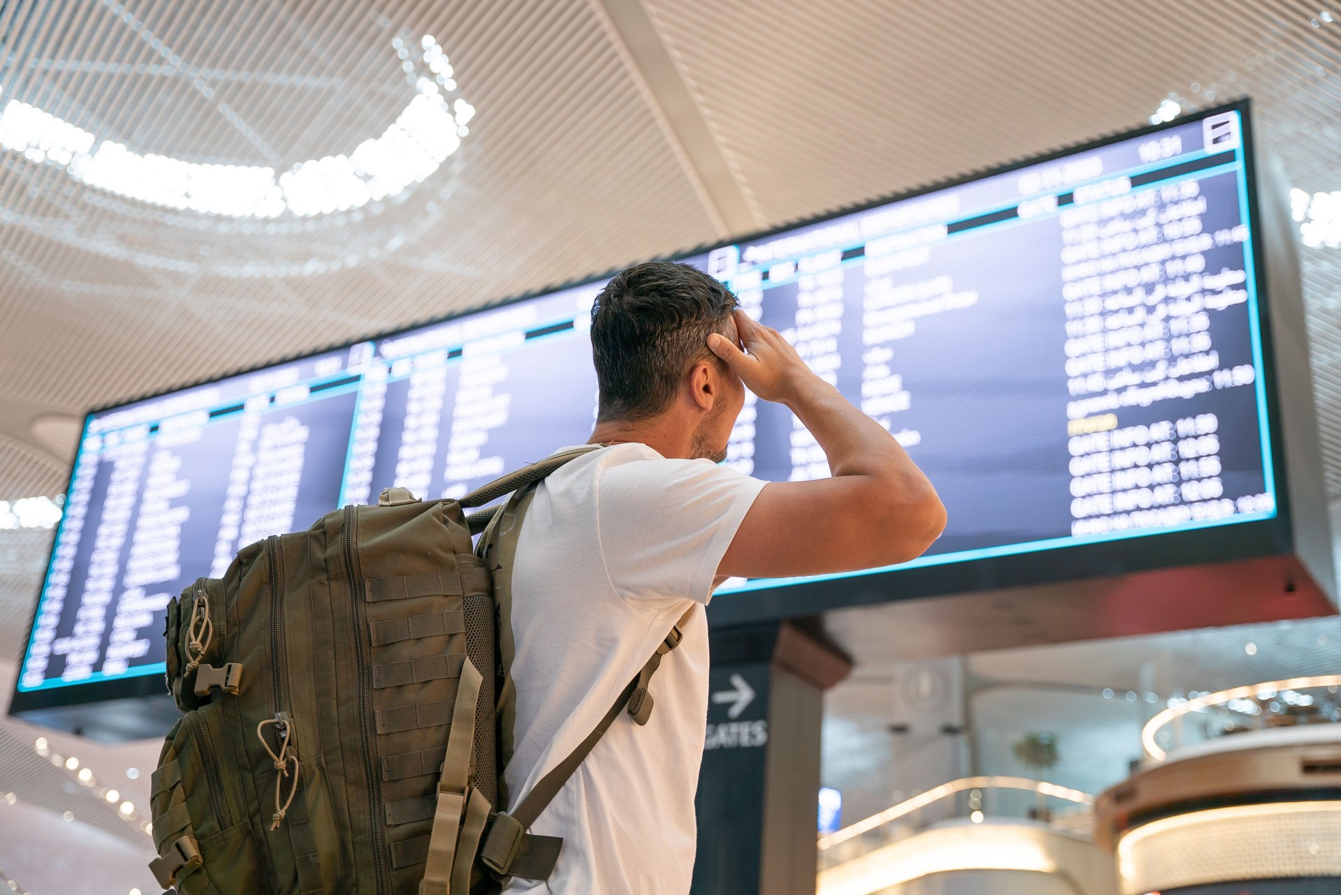 Passenger checking flight status for compensation due to delay or cancellation